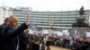 Outgoing Bulgarian Prime Minister Boyko Borisov waves to supporters outside the parliament in Sofia on February 21. It is unclear who will replace him following the elections.