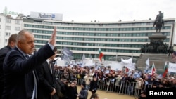 Outgoing Bulgarian Prime Minister Boyko Borisov waves to supporters outside the parliament in Sofia on February 21. It is unclear who will replace him following the elections.