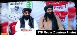 Tehrek-e Taliban Pakistan chief Noor Wali Mehsud (left) appears with another group leader in an undated photo.