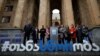 Women's right activists rally in front of the parliament building on International Women's Day in Tbilisi on March 8.