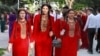 Young women in Ashgabat wearing traditional dresses in May 2017