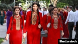 Young women in Ashgabat wearing traditional dresses in May 2017