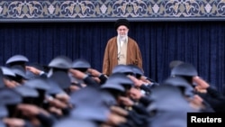 Iranian Air Force officers salute Supreme Leader Ayatollah Ali Khamenei in Tehran on February 7