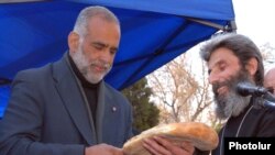 Armenian opposition leader Raffi Hovannisian ends his two-week hunger strike in Yerevan's Liberty Square on March 30.