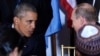 U.S. President Barack Obama (left) talks with his Russian counterpart Vladimir Putin at a luncheon during the UN General Assembly in New York on September 28. 