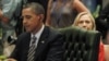 U.S. Secretary of State Hillary Clinton looks on from behind President Barack Obama's seat during an ASEAN-US Summit in 2011.