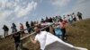 Protesters remove a border sign erected by Russian and Ossetian troops along Georgia's de-facto border with its breakaway region of South Ossetia in the village of Khurvaleti on July 14.