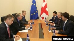 Georgian Prime Minister Giorgi Kvirikashvili (middle, right) meets in Batumi with Venice Commission President Gianni Buquicchio (middle left), parliament speaker Irakli Kobakhidze (bottom, right) and majority leader Archil Talakvadze in June.