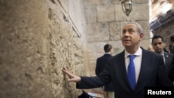 Prime Minister Benjamin Netanyahu visited the Western Wall in Jerusalem's Old City after casting his ballot.